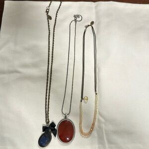 Al three necklaces are from Club Monaco.